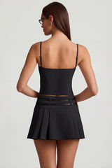 Belted Low-Rise Pleated Mini Skirt in Black